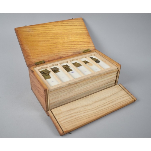 53 - An Early/ Mid 20th century Box Containing Eleven Trays of Gram Weights, Apothecary Weights Etc, 21.2... 