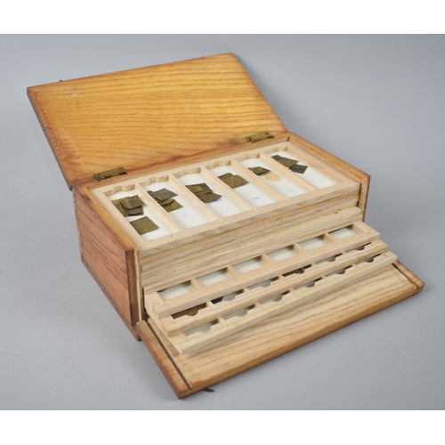 53 - An Early/ Mid 20th century Box Containing Eleven Trays of Gram Weights, Apothecary Weights Etc, 21.2... 