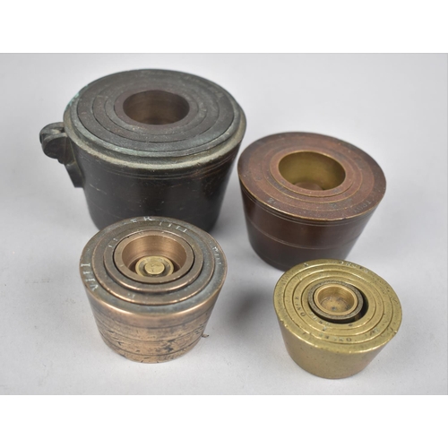 133 - A Collection of Four 19th Century Cup Weights in Brass and Bronze, Largest 8cms Diameter