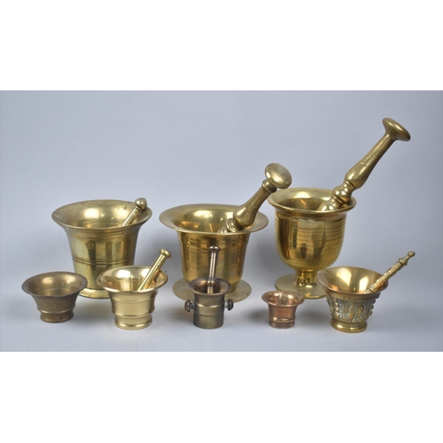 142 - A Collection of Brass and Bronze Mortars and Pestles