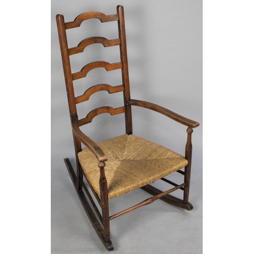 472 - A Mid 20th Century Rush Seated Ladder Back Rocking Chair