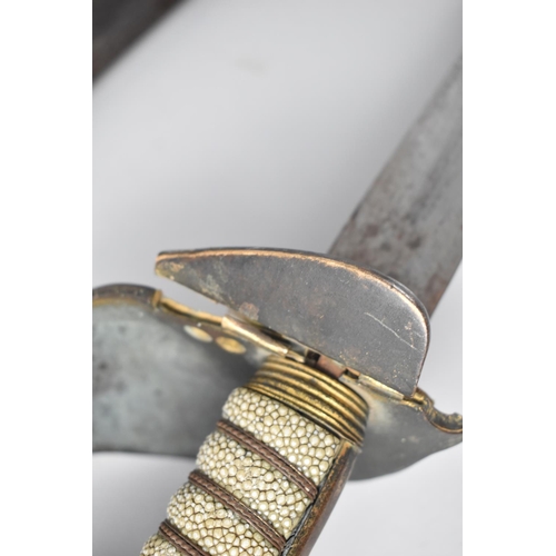 83 - An 1827 Pattern Naval Sword with Wired Shagreen Handle, Lion Pommel and Hinged Guard, Complete with ... 