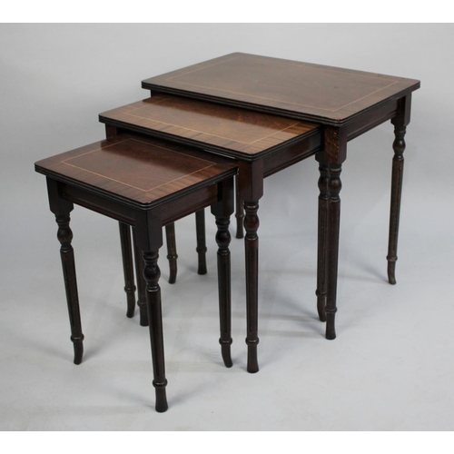 91 - A Late 20th Century Mahogany Nest of Three Tables, 53cms Wide