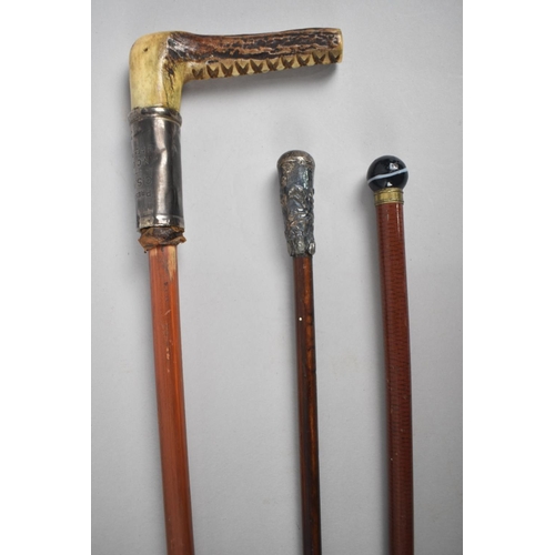 1 - A Collection of Two Swagger Sticks together with a Bone Handled Crop Example Inscribed 