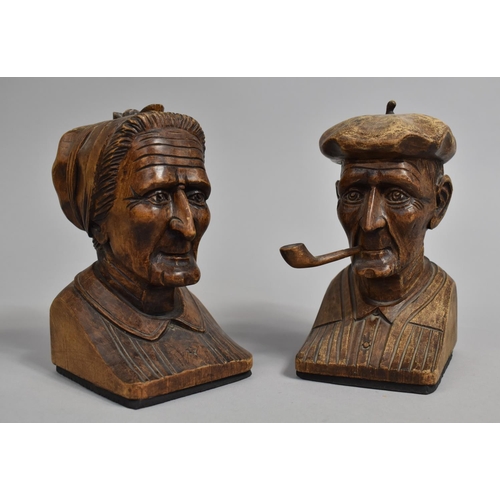 113 - A Pair of Carved Wooden Continental Book Ends in the Form of Elderly Husband and Wife, 16cms High