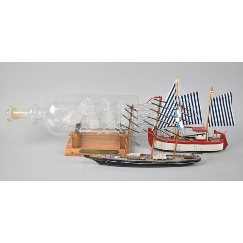 122 - A Modern Blown Glass Ship In A Bottle, The Winston Churchill together with Two Other Tall Ship Model... 