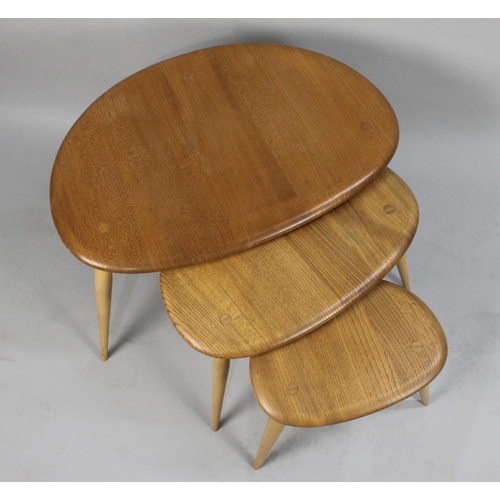 131 - A Nest of Three Ercol Pebble Tables, Golden Dawn