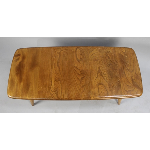 147 - A Vintage Ercol Golden Dawn Coffee Table with Under Shelf, 102cm Long