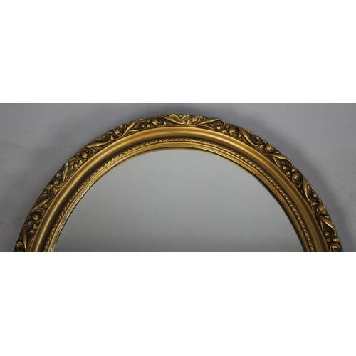 180 - A Mid 20th Century Moulded Gilt Framed Oval Wall Mirror, 54x44cm