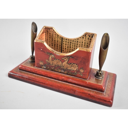 5 - An Oriental Lacquered Desk Top Pen Rest with Centre Stationery Well and on Stepped Rectangular Base,... 