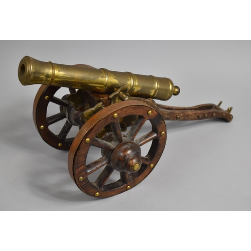 6 - A Large Brass and Wooden Model of a Spanish Cannon, 61cms Long