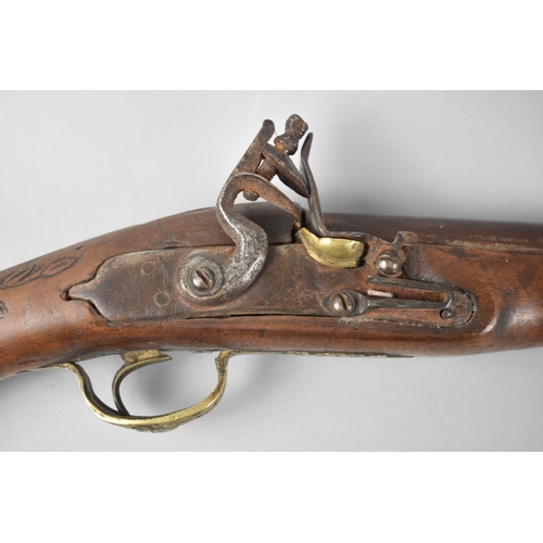 93 - A Continental Brass Mounted Flintlock Blunderbuss with Carved Stock, 60cms Long