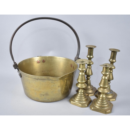 96 - A Vintage Brass Jam Kettle and Two Pairs of Brass Candlesticks