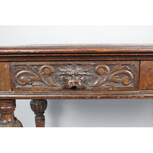 110 - A Late Victorian Gothic Revival Side Table with Two Carved Drawers and Carved Bulbous Supports, Inse... 