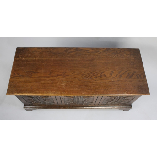 158 - A Mid 20th century Oak Lift Top Carved Fronted Blanket Box, 94cms Wide