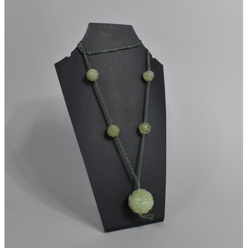 245 - A Five Carved Jade Beaded Necklace