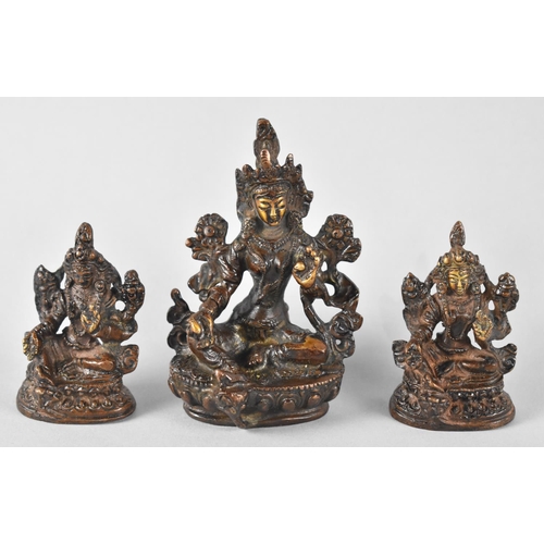 3 - A Set of Three Small Patinated Bronze Buddhas on Lotus Thrones, Tallest 9cms High