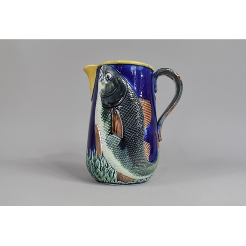 352 - A 19th/20th Century Majolica Jug Decorated in Relief with Fish and with Stylised Fish Handle, Has be... 