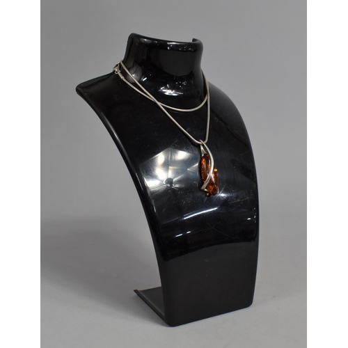 393 - A Silver and Amber Pendant on Silver Chain