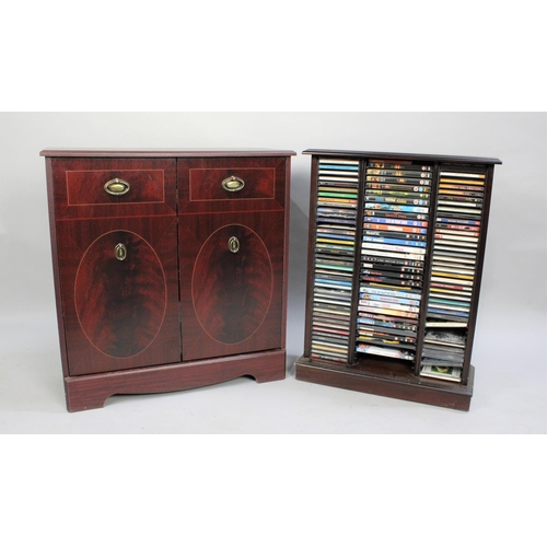 429 - A Large Collection of DVDs and CDs inside 2 Modern Mahogany Stands