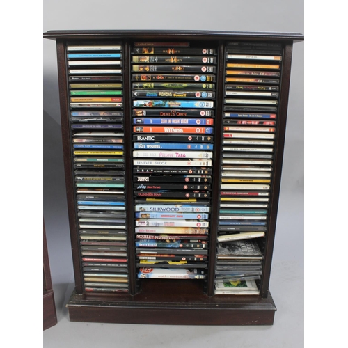 429 - A Large Collection of DVDs and CDs inside 2 Modern Mahogany Stands