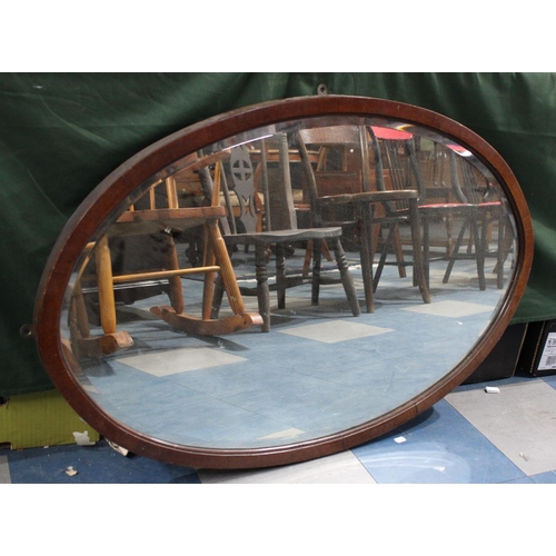 430 - An Edwardian Mahogany Oval Wall Mirror, 98x84cms