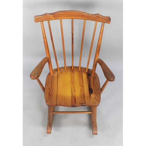 481 - A Mid 20th Century Varnished Pine Spindle Back Rocking Chair