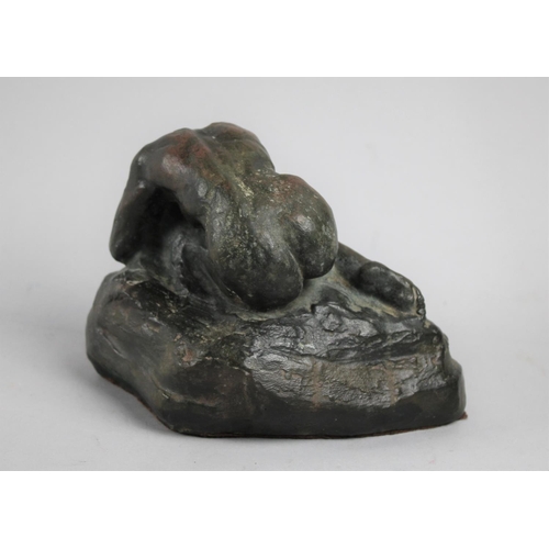 57 - A Cast Resin Bronze Effect Sculpture of Female Nude Huddled on Rock, Signed Cavacos