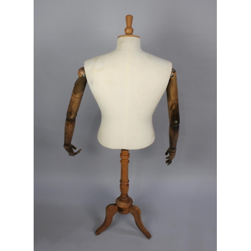 87 - A Late 20th century Dressmaker's Display Mannequin with Articulated Wooden Arms, One Finger AF, on T... 