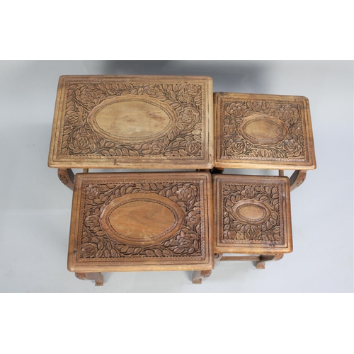 97 - A Nest of Four Carved Oriental Tables, Smallest with Single Drawer, 44cms Wide