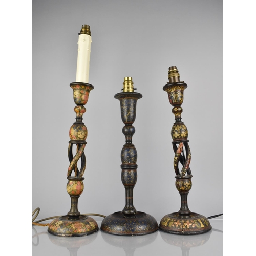 70 - Three Kashmiri Table Lamps all decorated in Polychrome Enamels on Ebonised Ground, Two Examples with... 