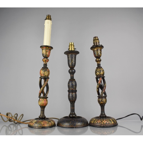 70 - Three Kashmiri Table Lamps all decorated in Polychrome Enamels on Ebonised Ground, Two Examples with... 