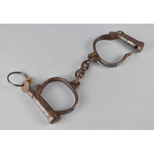 A Pair of Early 20th Century Steel British Made Handcuffs by Hiatt Complete with Key