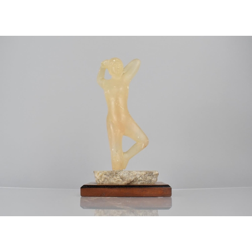 75 - An Early 20th Century Carved Calcite Figure of a Female Nude, Mounted on Mahogany Plinth, 25cms High