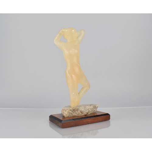 75 - An Early 20th Century Carved Calcite Figure of a Female Nude, Mounted on Mahogany Plinth, 25cms High