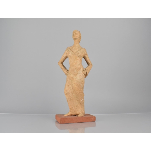 76 - An Early 20th Century Sculpted Terracotta Figure of an Elegant Woman in Evening Dress, 34cms High