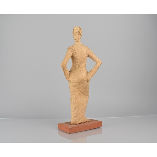 76 - An Early 20th Century Sculpted Terracotta Figure of an Elegant Woman in Evening Dress, 34cms High