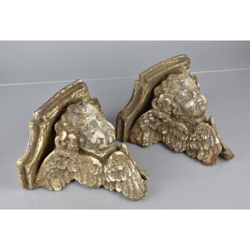 78 - A Pair of 20th Century Lead Plaster Cast Corbels Modelled as Baroque Winged Cherubs 13x22x21cms High