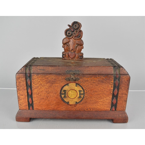 24 - An Early 20th Century New Zealand Maori Carved Wooden Box, Top Decorated with a Carved Hei-Tiki Figu... 