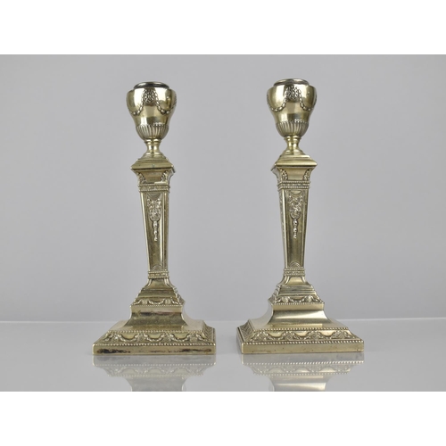 198 - A Pair of White Metal Neo-Classical Candlesticks with Iron Loaded Bases, 20cms High