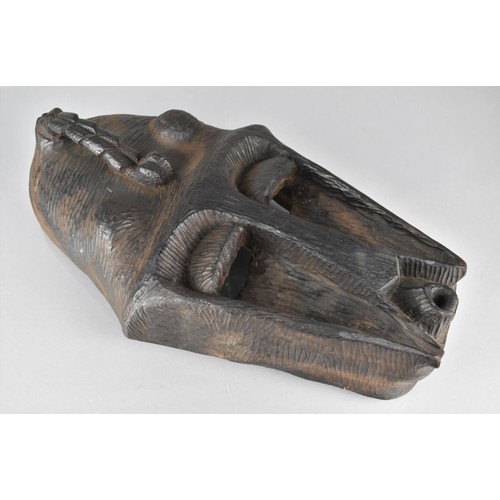 151 - A Heavy Carved African Tribal Mask, 43cms High