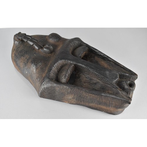 151 - A Heavy Carved African Tribal Mask, 43cms High