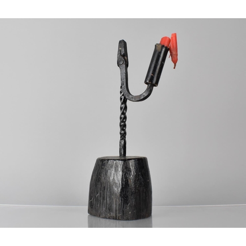 194 - An Early Wrought Iron Rush Light Set on Wooden Block Base, 28cms High. Condition: Not perfect order ... 