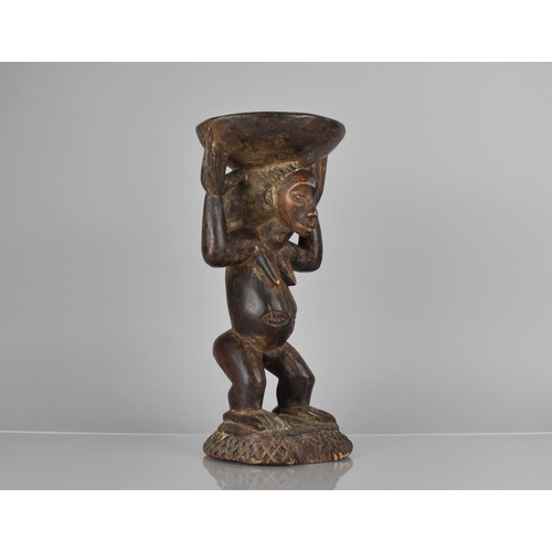 149 - A West African Figural Stool, 28cms High