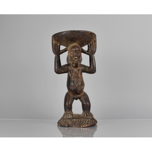 149 - A West African Figural Stool, 28cms High