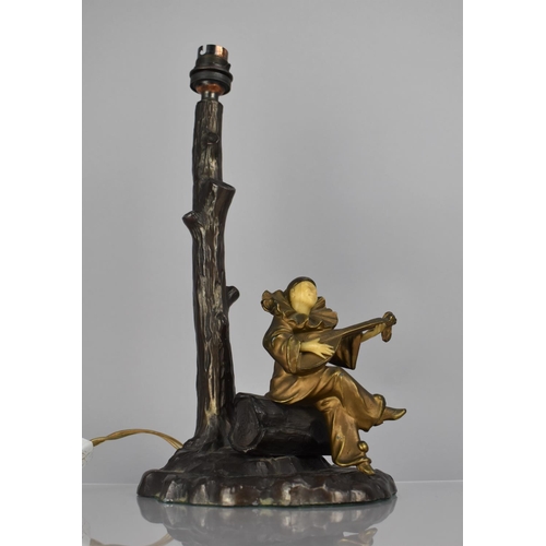 184 - After Chiparus, A Bronze Figural Table Lamp Base in the form of Clown Playing Lute Under Tree, 34cms... 