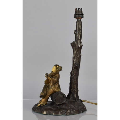 184 - After Chiparus, A Bronze Figural Table Lamp Base in the form of Clown Playing Lute Under Tree, 34cms... 