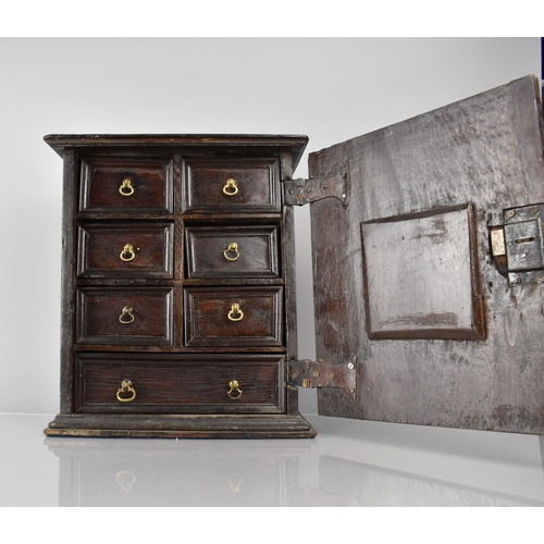 52 - A Jacobean Oak Spice Chest or Cupboard having Six Short and One Long Drawers behind Geometric Carved... 