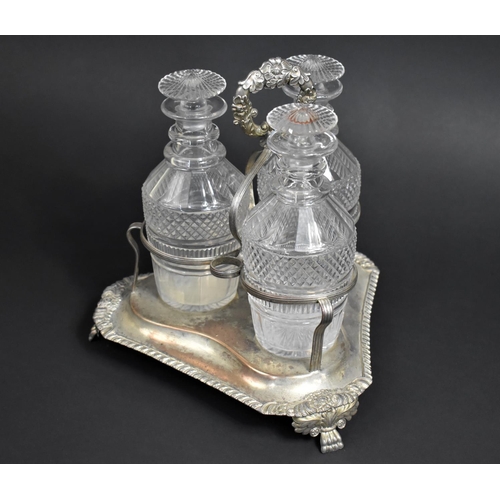 257 - A Georgian Three Bottle Tantalus on Silver Plated Stand, Glass Bottles of Mallet Form having Cut Hob... 