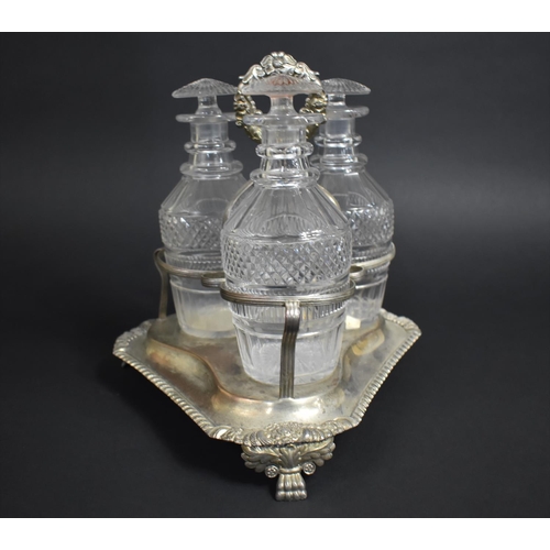 257 - A Georgian Three Bottle Tantalus on Silver Plated Stand, Glass Bottles of Mallet Form having Cut Hob... 